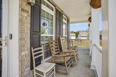 Imagine coffee on this large, covered front porch.