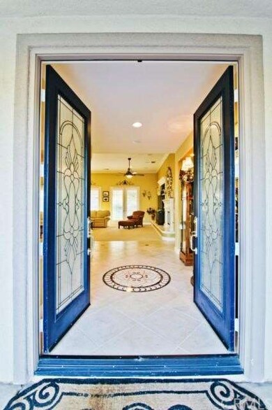 Dramatic double door entry with decretive marble m