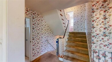 Stairway to second floor and lower level