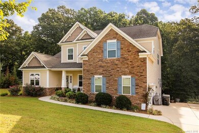 Inviting front porch and pretty stacked stone acce