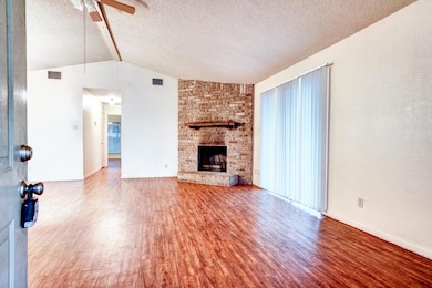 Unfurnished living room with wood finished floors