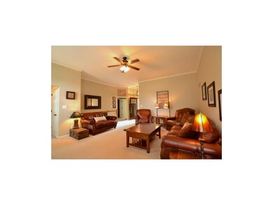 Spacious living room with crown molding.