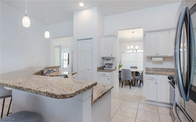 Kitchen with stainless steel refrigerator, a kitch