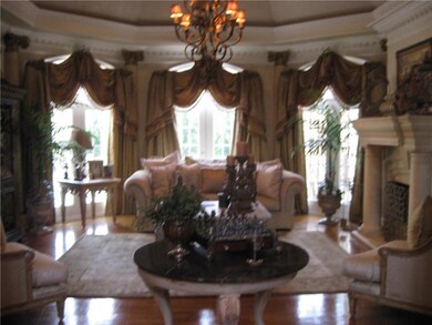 Living room featuring a chandelier and wood finish