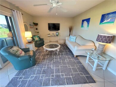 Tiled living room with baseboards and ceiling fan