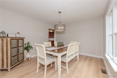 The gorgeous dining room features an exquisite cha