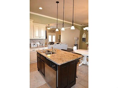 Kitchen. large island with a sink, seating area, a