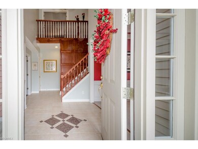 Inviting 2 Story Custom Tiled Foyer and Gallery Ha