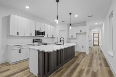 Kitchen with appliances with stainless steel finis