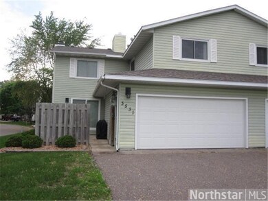 Front of townhome with walk in patio area