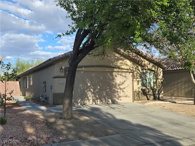 View of home's exterior with a tile roof, concrete