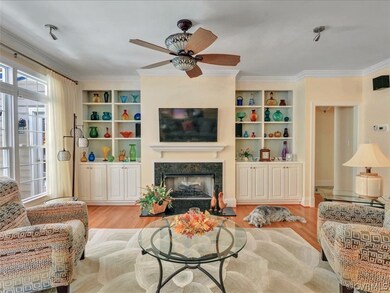 Living room with built-in cabinets, fireplace with