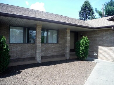 Welcoming front porch just needs you and a comfy s