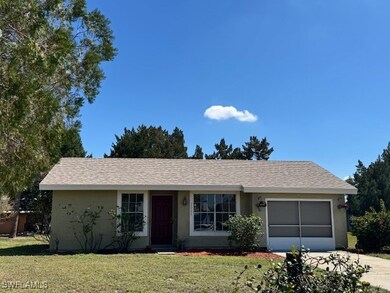 Ranch-style house featuring a garage, concrete dri