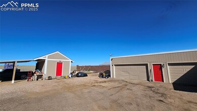 Garage featuring fence