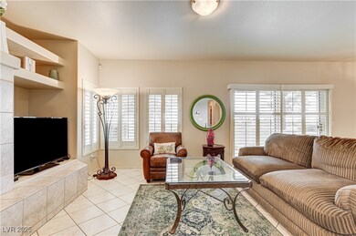 Living room with light tile patterned floors