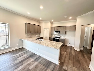 Kitchen with stainless steel finishes, pantry and huge breakfast bar