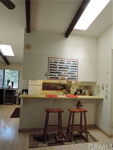 Breakfast bar with two skylights to open kitchen