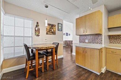 Kitchen with backsplash, decorative light fixtures