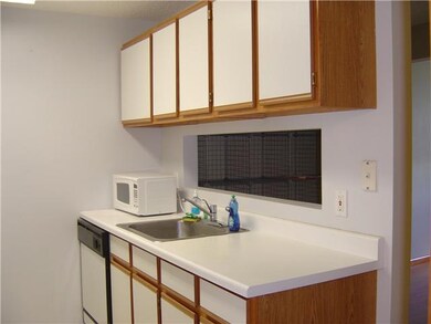 Kitchen. Galley kitchen has ample cabinets and cou