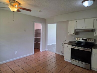 The kitchen / dining combination with a walk-in pantry.