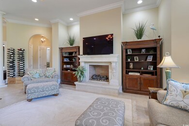 Living room featuring crown molding