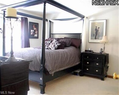 the owners suite showing a walk-in closet and full