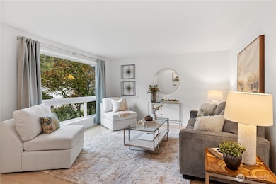 Living room with natural light from the large front window