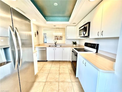 Kitchen featuring sink, light tile patterned floor