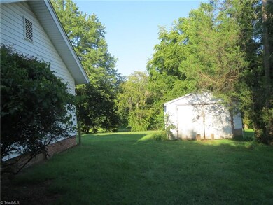 View of side yard and storage shed.