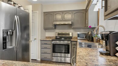 Kitchen features stainless appliances, pantry, sli