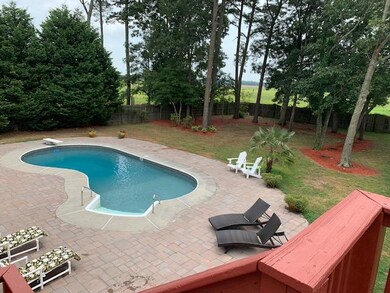 Pool surrounded by custom pavers