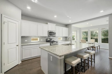 Kitchen featuring stainless steel appliances, dar