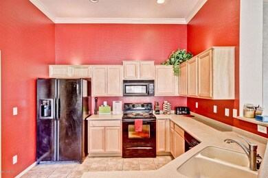 kitchen has maple cabinets/corian