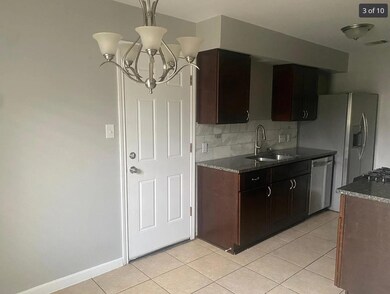 Kitchen with a sink, stainless steel dishwasher, 