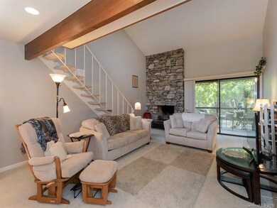 View of living room looking out to screened porch.