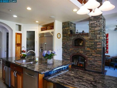 Stone counters, six burner stove, built in refrigerator, step in pantry