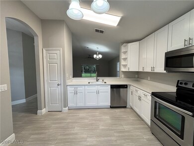 Kitchen with appliances with stainless steel finis