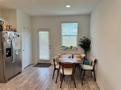 Dining room featuring light wood-style floors and