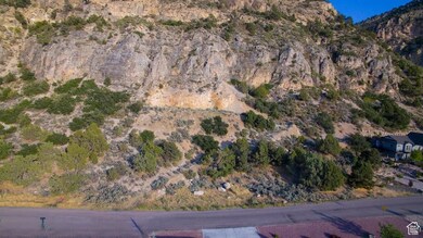 Aerial view of property's location with a mountainous background