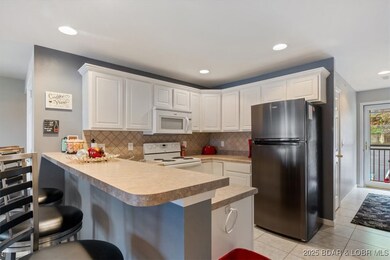 Trim work above cabinets, custom tile back splash,