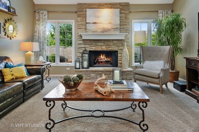 COZY GATHERING SPACE OPEN TO THE KITCHEN WITH HIGH