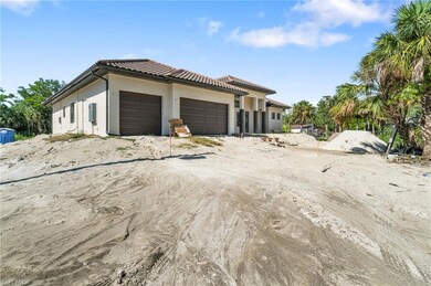 View of front of property featuring an attached garage, stucco siding, and a tiled roof