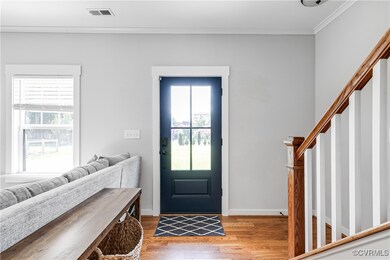 Entrance foyer with wood floors