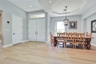 Dining area featuring light wood-style flooring, a