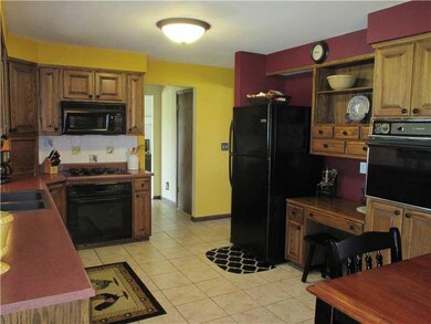 Kitchen. French doors leading to the 3 season room