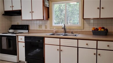 Eat-In Kitchen includes appliances. Ceramic tile back-splash.