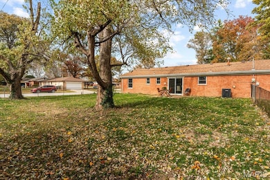 Back of house with brick siding