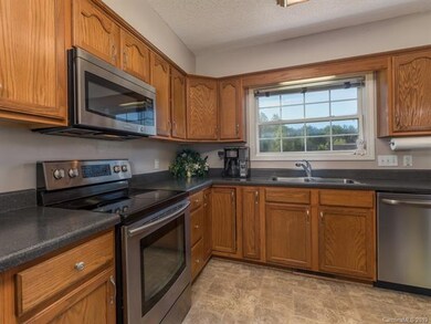Lots of cabinetry and window overlooking backyard