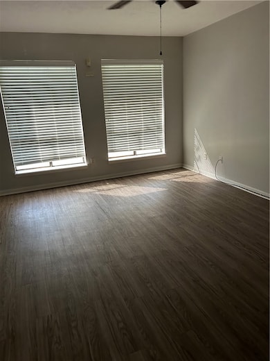 Spare room featuring wood finished floors, ceiling
